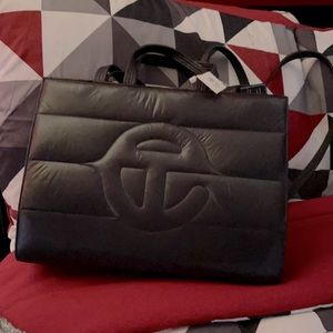 telfar bag featuring iconic logo engineered into bands of quilted nylon puff